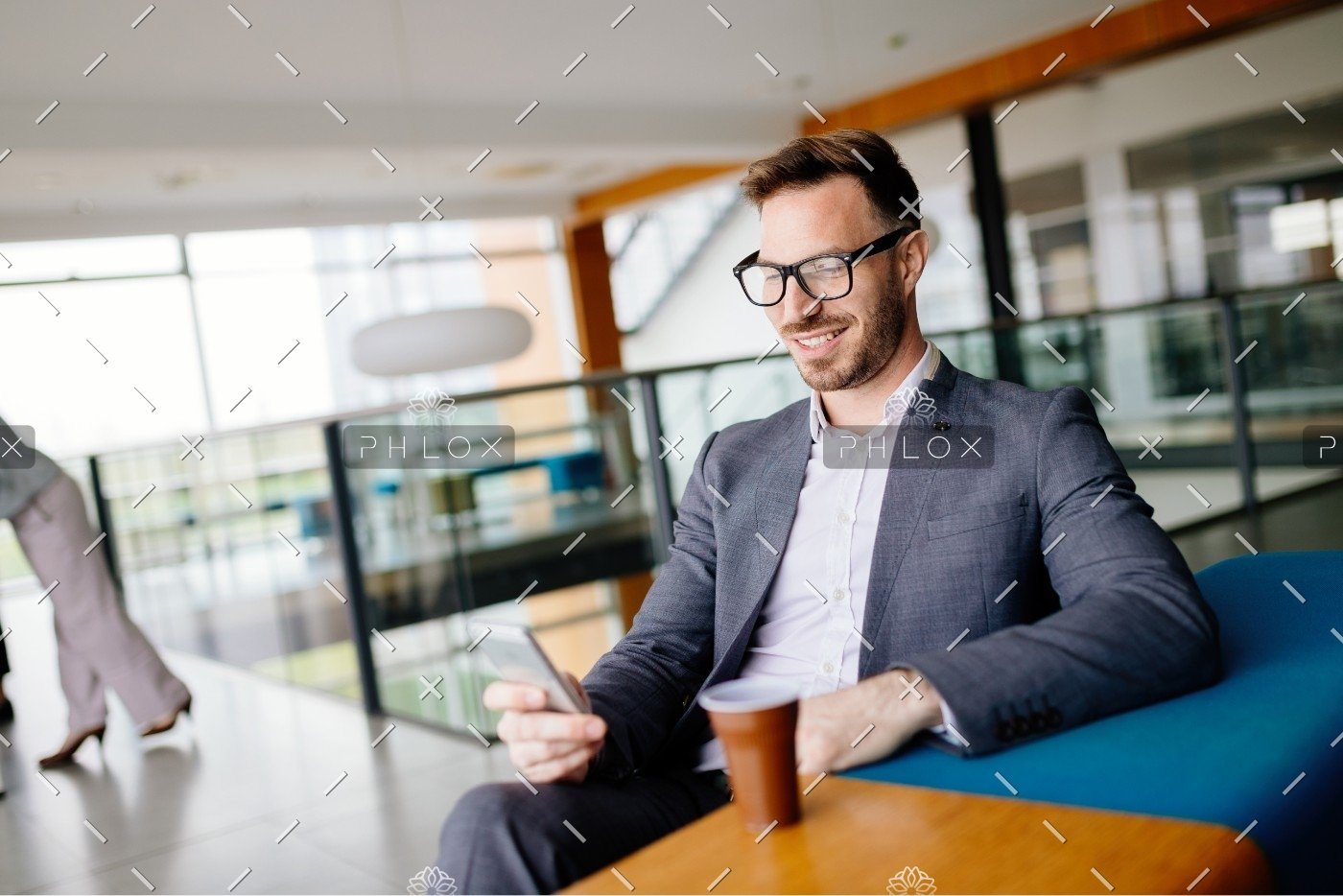 demo-attachment-437-businessman-taking-a-break-with-a-cup-of-coffee-JW4B3DH